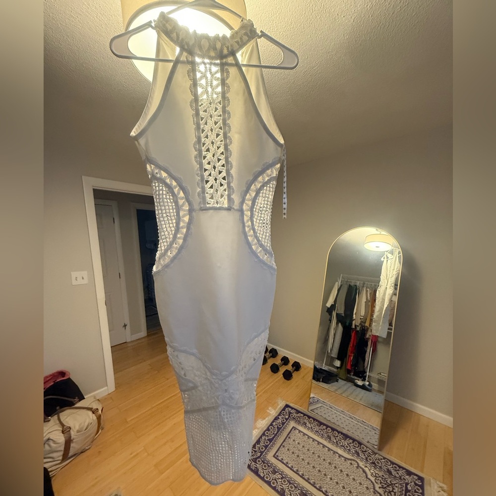 Elegant White Sleeveless Dress. So elegant but yet so sexy.